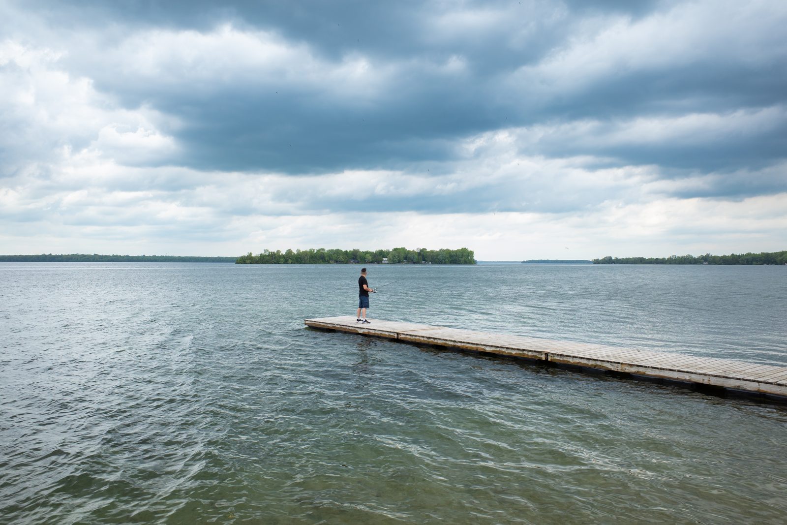 Fisherman on calm water